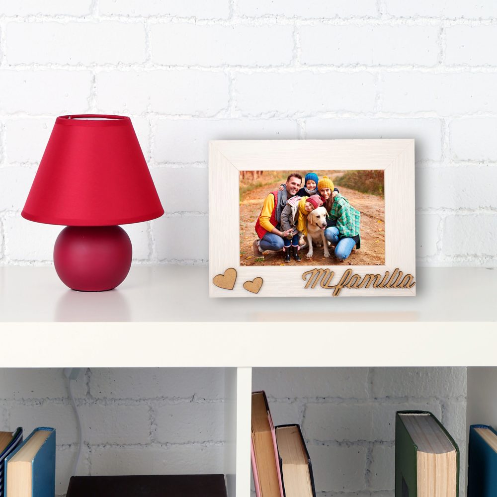 Wooden shelf with books and lamp on brick wall background